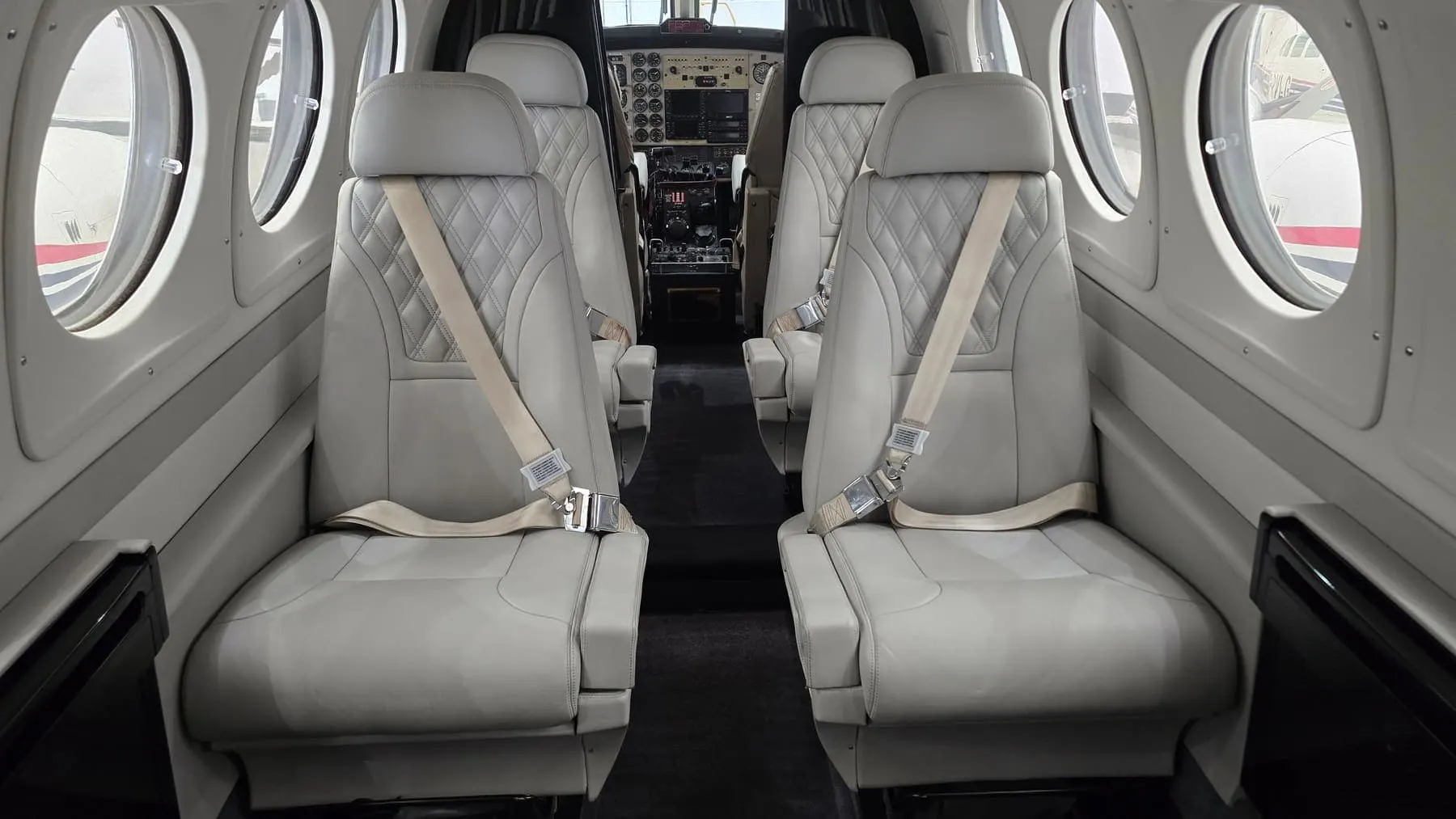 King Air cabin and cockpit divider in quilted white leather