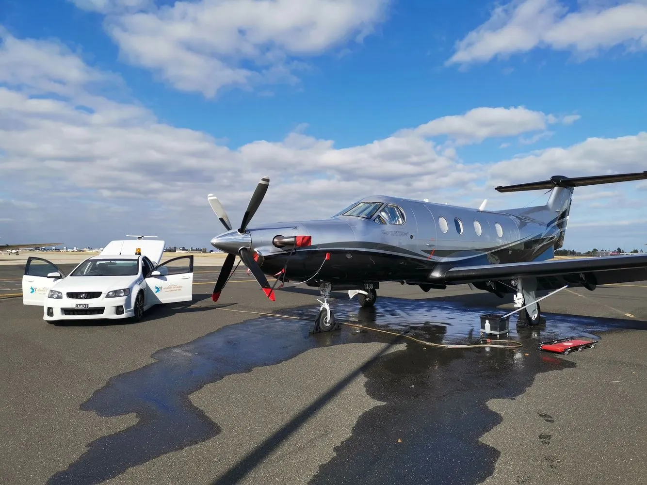 Jet Refined mobile service vehicle working alongside a Pilatus PC-12 on the ramp
