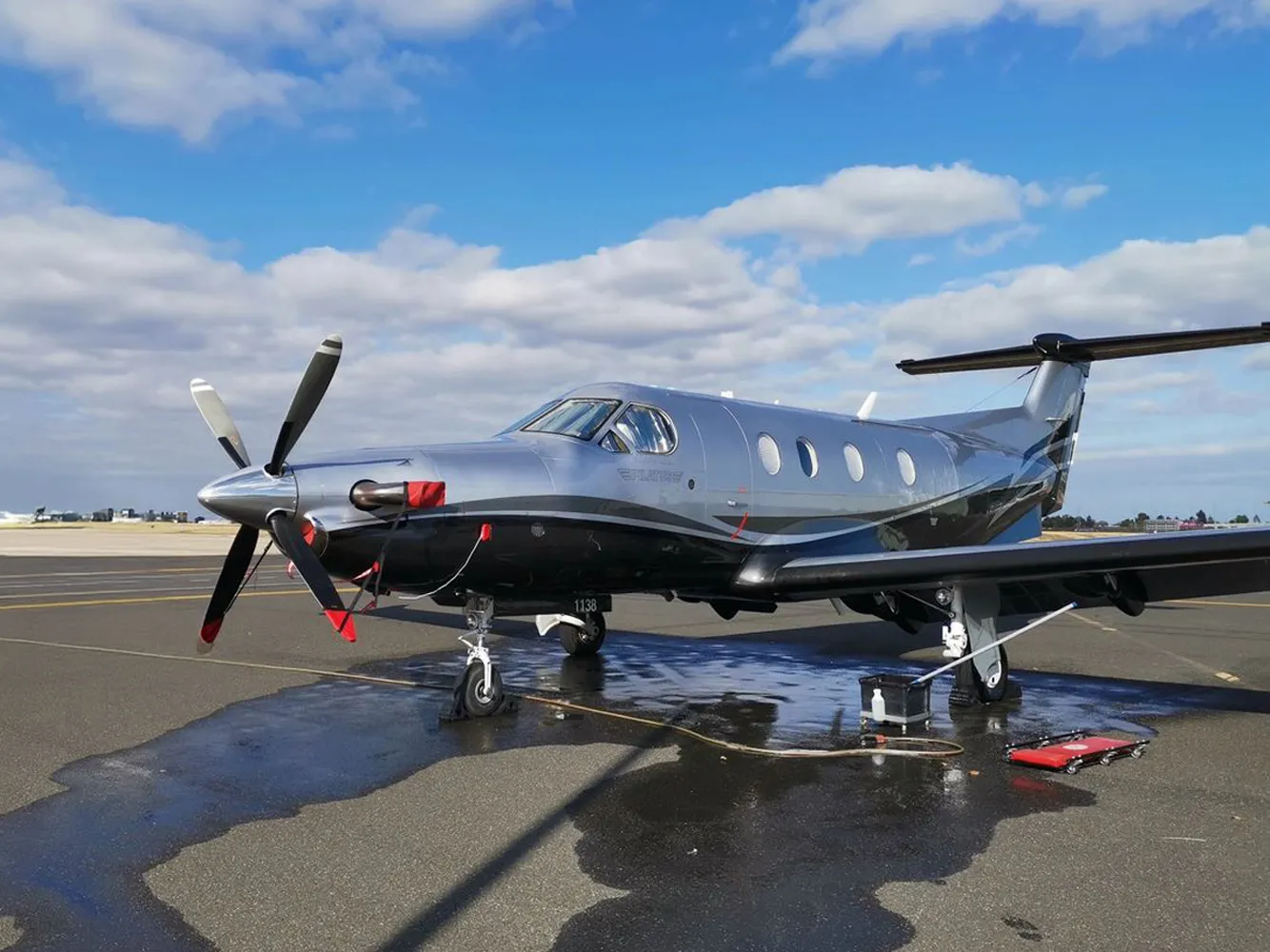 Jet Refined mobile service vehicle working alongside a Pilatus PC-12 on the ramp