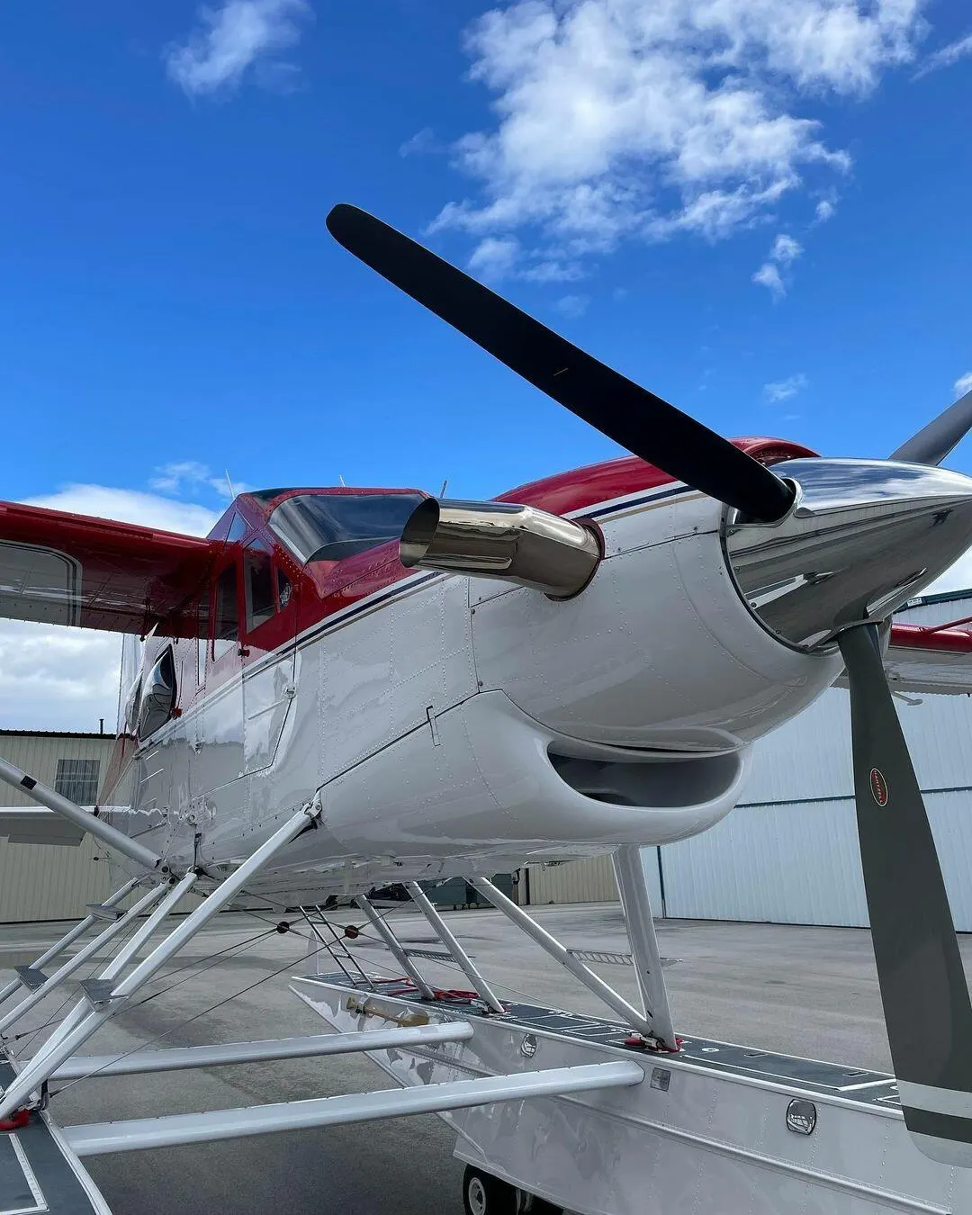 Turboprop propeller and polished spinner against a blue sky